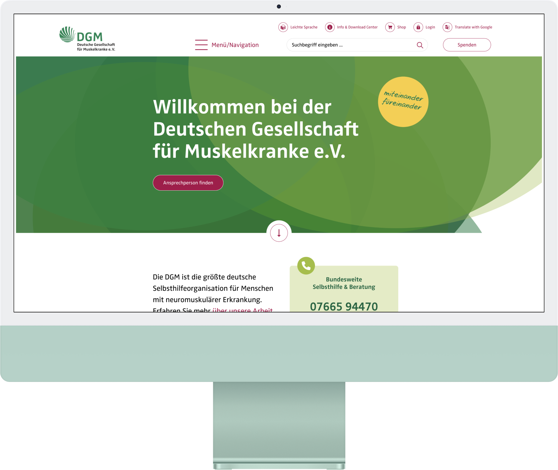 A desktop mockup with a screenshot of the DGM website.